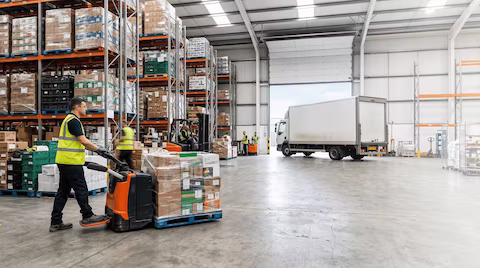 A 7.5 tonne lorry delivering goods to a warehouse in Kent, UK